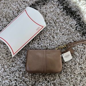 Coach shimmery nude wristlet